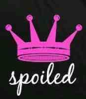 a pink crown with the word spoiled on it's back and white writing underneath