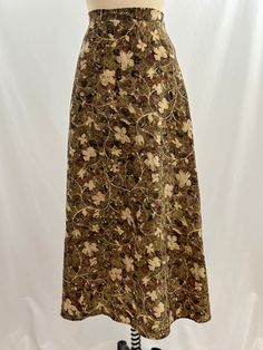 This vintage 90s skirt is a summer must have.  In hues of a mossy green beige black and maroon floral pattern, it has a zip up back with a single button and partial elastic waist. Pair with a raw hem cropped white tee. -Vintage 90s -Floral, grunge  -Machine wash, line dry Measurements: *Waist  14 1/2 inches *Hips 19 inches *Length 36 1/2 inches *Please note this item is pre-loved and there may be minor flaws to the garment. Not to worry if there is anything major we will let you know. --Returns Brown Floral Skirt, Grunge Dark Academia, 90s Skirt, Floral Grunge, Cropped White Tee, 90s Floral, Black Grunge, Brown Floral, Dark Academia