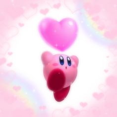 a pink heart shaped object floating in the air