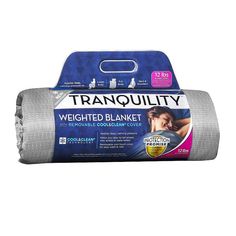 the tranquility weighted blanket is shown in front of a white background and blue packaging