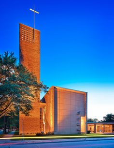 an image of a church that is lit up in the evening time with lights on