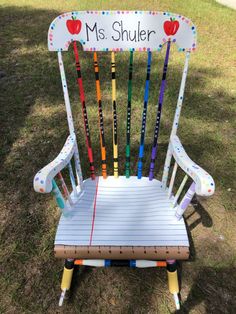 a chair made out of crayons and sticks with the name ms shuler on it