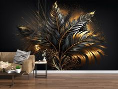 a living room with a couch, table and large wall mural in gold and black