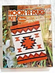 the cover of hooka rug magazine shows an orange and white blanket with black stripes