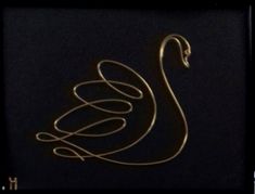 a golden swan with swirls on it's back