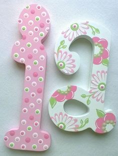 the letters are decorated with flowers and dots