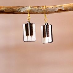 the earrings are made out of white and black piano keys