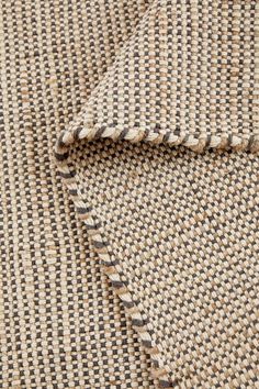 a close up view of the fabric on a piece of cloth that has been woven into it