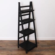 PRICES MAY VARY. MILLTOWN MERCHANTS LADDER BOOKSHELF - The Milltown Merchants black bookshelf comes with a unique rustic finish paired with a clean, modern silhouette. The carefully curated display is great for showcasing photo frames, succulents, art, small house plants, wicker baskets, and books. Create an eye catching display to compliment your unique space with the Milltown Merchants wooden bookshelf! EASY SETUP / NO TOOLS REQUIRED - The Milltown Merchants leaning bookcase takes just seconds Black Ladder Shelf, Brown Bookshelf, Succulents Art, Leaning Bookshelf, Farmhouse Bookshelf, Traditional Bookcases, Wooden Ladder Shelf, Black Bookshelf, Rustic Bookshelf