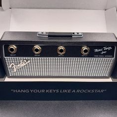 a black and white amp with the words hang your keys like a rockstark on it