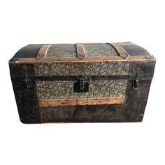 an old trunk is sitting on a white background