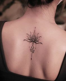 a woman with a tattoo on her back