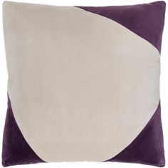 a purple and white pillow with an abstract design on the front, along with a contrasting color block