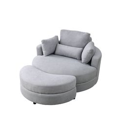 a large gray chair and ottoman on a white background