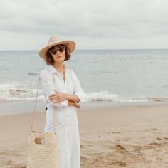 The Salty, our handwoven straw tote bag, embodies the California state of mind - effortless beach style and functional sustainability. Worn over the shoulder, as a crossbody, or styled for a dressier occasion as a straw handbag, the removable leather strap makes the Salty tote your most versatile accessory for summer. The hand-dyed, 100% genuine leather strap and handles in our signature 'salt,' neutral tone and matte gold hardware elevate the Salty straw bag for a chic coastal look. Each handmade bag is unique and may have small imperfections or vary in size and color. All Leah products are responsibly sourced and ethically crafted. 14 x 4.5 x 16 in Imported Spring Travel Crossbody Straw Bag, Chic Summer Straw Bag For Everyday, Chic Everyday Summer Straw Bag, Chic Straw Bag For Everyday And Vacation, Chic Natural Straw Bag For Travel, Everyday Vacation Straw Bag, Travel Beach Bag With Natural Fiber, Chic Summer Straw Bag With Leather Handles, Everyday Summer Straw Bag With Adjustable Strap