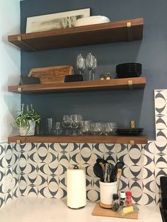 the kitchen counter is clean and ready to be used for dishes, wine glasses, etc