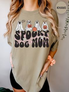 This Halloween Spooky Dog Mom Comfort Colors T Shirt is great for fall, autumn, Halloween and anytime you want to show that you love Halloween and dogs! The design features cute dogs wearing ghost sheets with jack-o-lantern trick or treat buckets. Purchase for yourself or as a gift for your favorite Halloween and dog lover. Comfort Colors introduces its garment-dyed t-shirt; a fully customizable tee made 100% with ring-spun cotton. The soft-washed, garment-dyed fabric brings extra coziness to yo Cricut Halloween Shirt Ideas, Fun Halloween T-shirt With Screen Print, Spooky Halloween Graphic T-shirt, Dog Mom Halloween Shirt, Dtf Shirts, Tshirt Aesthetic, Dog Clothes Halloween, Spooky Cat Design T-shirt For Fall, Fall Tshirt