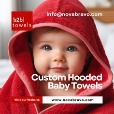 a baby wrapped in a red towel with the caption, custom hooded baby towels