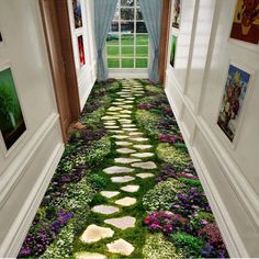 the hallway is decorated with green grass and white stepping stones that lead to an open window