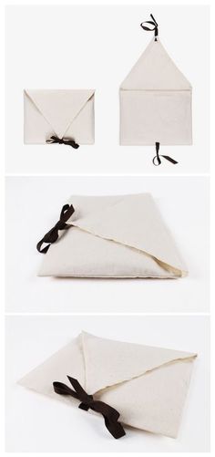 the instructions for how to fold an origami envelope with black ribbon and bow