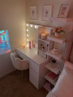 a bedroom with a vanity, mirror and lights on it's sides is shown