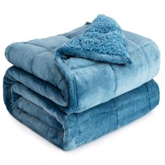 two blue blankets stacked on top of each other