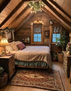 an attic bedroom with wooden walls and ceiling, decorated with christmas lights above the bed