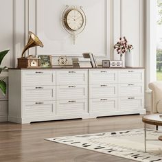 a living room filled with furniture and a clock on the wall