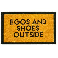 a yellow door mat with black words on it that says, eggs and shoes outside