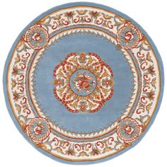 a blue and red rug with an ornate design