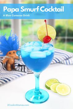 a blue curacao drink with a cherry garnish