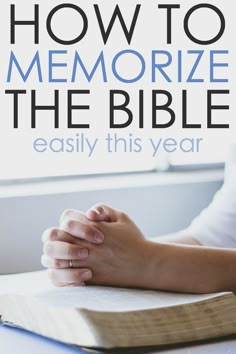 a person holding their hands on top of an open book with the title how to memoize the bible easily this year