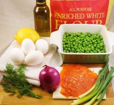 peas, carrots and other vegetables are on a cutting board next to a bag of flour