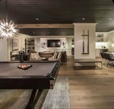 a pool table in the middle of a living room