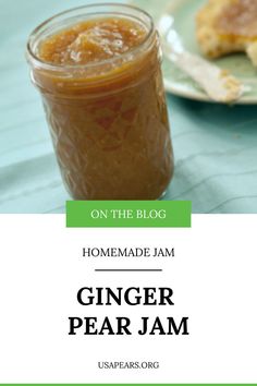 a glass jar filled with ginger pear jam on top of a blue table cloth next to a