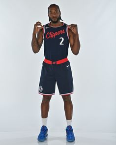 a basketball player is posing for the camera