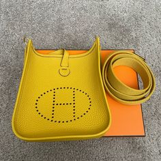 Yellow Mini Hermes Evelyn, Brand New, Never Worn, Shipped With Box, Dust-Bags, And Original Receipt Yellow, Handbags, Evelyne Hermes, Hermes Bags, Travel Case, Cloth Bags, Dust Bag, Bag Lady, Brand New