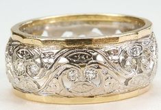 an ornately decorated wedding band is shown in yellow gold and white gold with diamonds