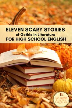 an open book sitting on top of a pile of books next to pumpkins and leaves