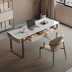 a white desk with a laptop on it in front of a window next to a chair