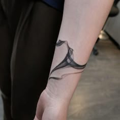 a person with a tattoo on their arm