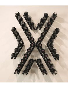 a group of wine bottles arranged in the shape of x