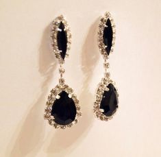 Old Hollywood Style, these earrings have a elegance, you will be able to use them for a long time to come, earring arrive in protective bag so you can be stored and protected.This sparkle black rhinestone earring are made from a rhinestone marquise post with a black stone in the center, and the bottom is perfect sized tire drop surrounded by sparkling rhinestones and black stone in the center.  Total length is just pass 1 ¾ “making them a perfect length to finish your glamour’s look.” These earr Black Diamond Earring, Black Gem Earrings, Old Hollywood Earrings, Long Black Earrings, Black Sparkly Earrings, Black Earrings With Rhinestones For Gift, Gift Black Earrings With Rhinestones, Elegant Black Crystal Rhinestone Earrings, Elegant Black Crystal Earrings With Rhinestones