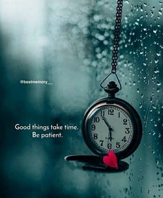 a clock hanging from the side of a window with raindrops on it and a quote about good things take time be patient