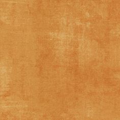 an orange colored background with some stains on it's surface and the color is very soft