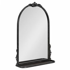 an ornate black mirror on a white background