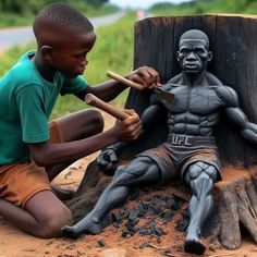 a young boy sitting next to a tree stump with a statue of a man holding a baseball bat