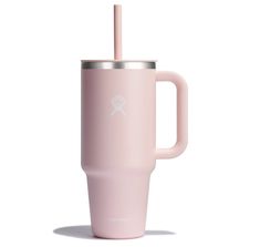 a pink tumbler cup with a straw sticking out of it's side, on a white background