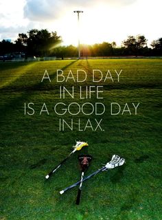 two lacrosse sticks laying in the grass with a quote on it that says, a bad day in life is a good day in lax