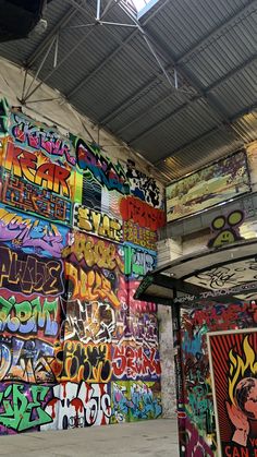 the walls are covered with colorful graffiti